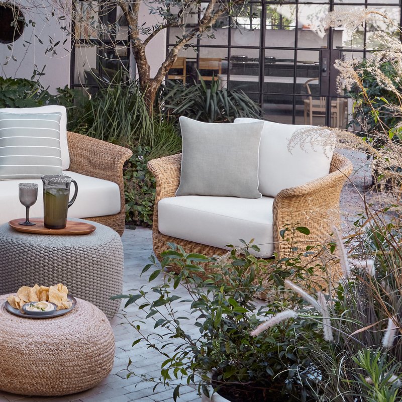 Cane Sofa with chair on site view