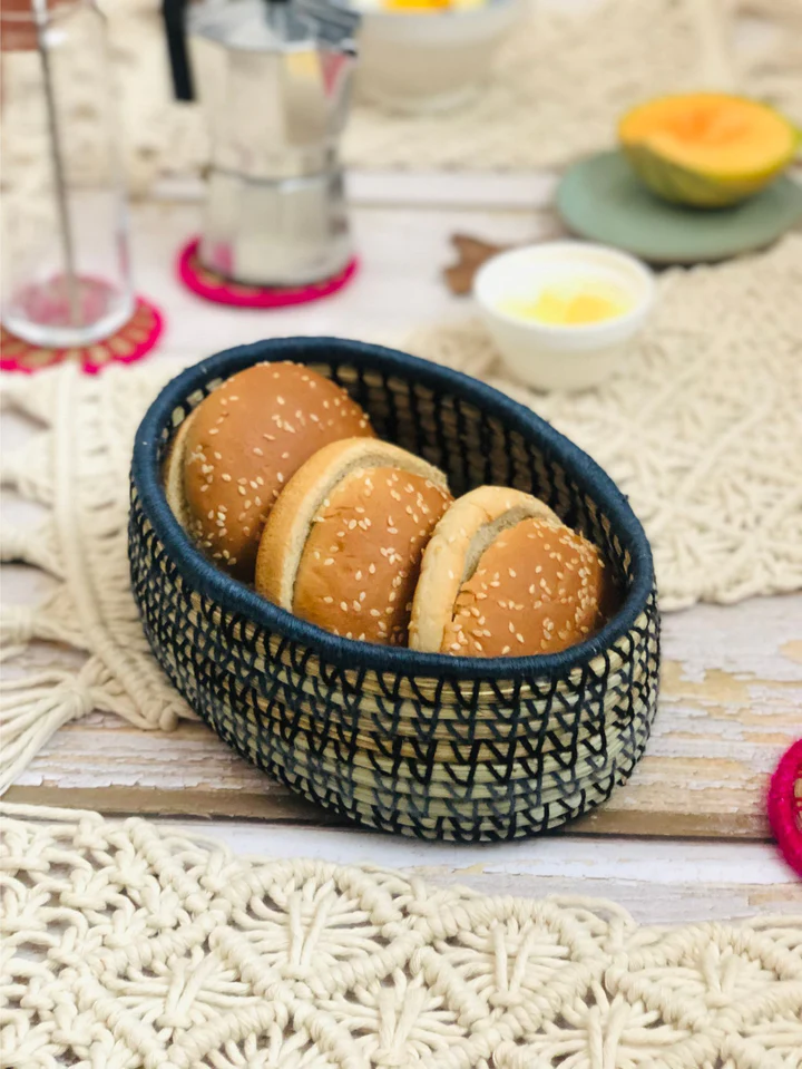 Handcrafted salt reed oval bread basket on dining