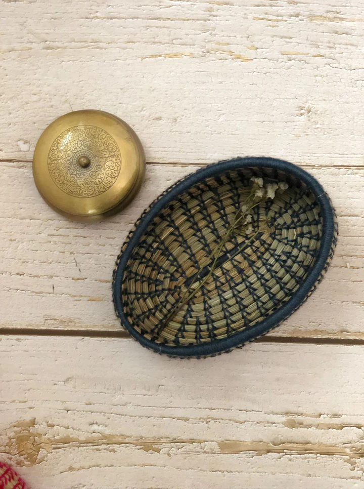 Handcrafted salt reed oval bread basket on table